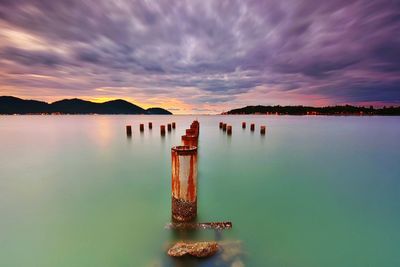 Scenic view of lake against sky during sunset