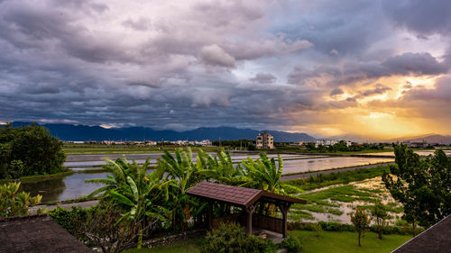 Scenic view of lake against sky during sunset