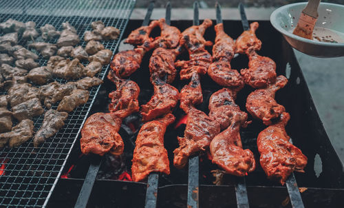 High angle view of meat on barbecue grill