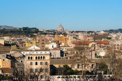 Townscape against clear blue sky