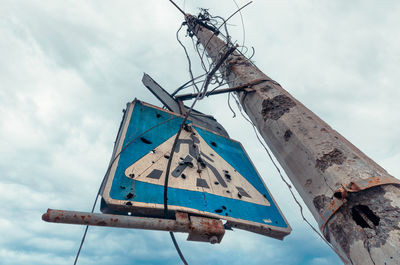 Low angle view of windmill against sky