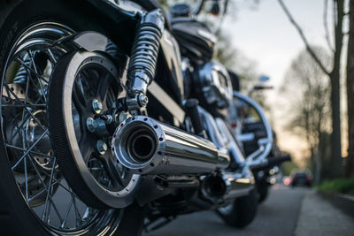 Close-up of motorcycle parked on road