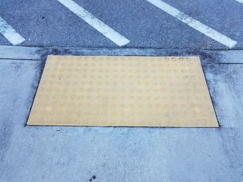 High angle view of arrow sign on road