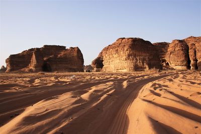 Rock formations in desert against clear sky