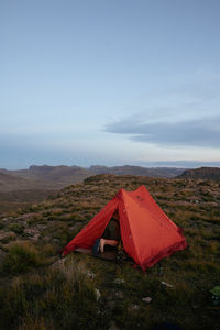 Tent on field against sky