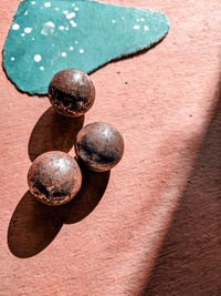 High angle view of rusty metal on wood