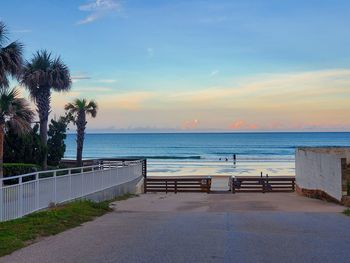 Scenic view of swimming pool by sea against sky