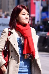 Young woman standing in city during winter