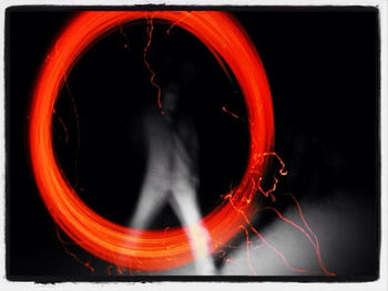 Close-up of light painting against black background