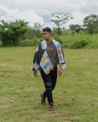 Portrait of man standing on field