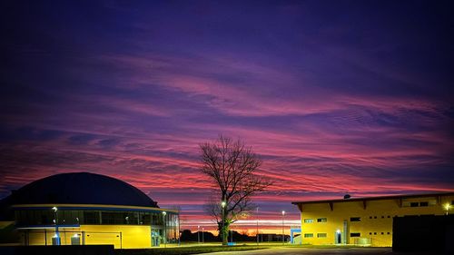 Buildings against sky at dusk