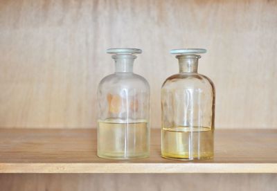 Close-up of liquid in bottles on table