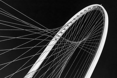 Low angle view of bridge against sky at night