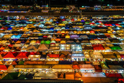 High angle view of people in market at night