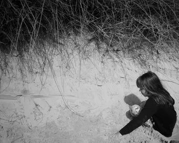 Woman sitting on floor