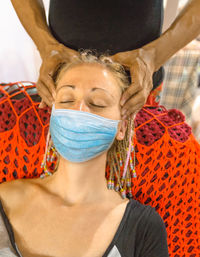 Close-up portrait of a young woman with eyes closed