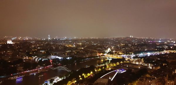 High angle view of illuminated buildings in city at night