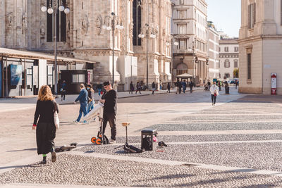 People walking on street in city