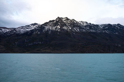 Scenic view of mountains and sea against sky