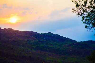 Scenic view of mountains against sky during sunset