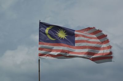 Low angle view of malaysian flag against sky