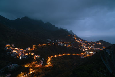 High angle view of illuminated cityscape against sky