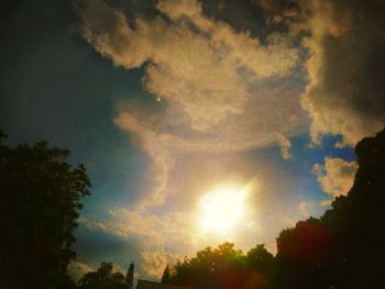 Low angle view of silhouette trees against sky during sunset