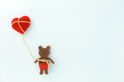 Close-up of red toy against white background