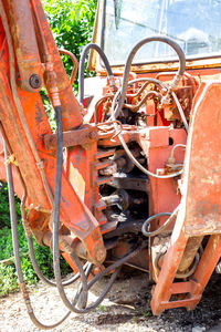 Old rusty car on field