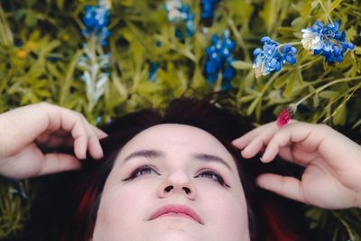 Close-up of woman hand with pink flowers