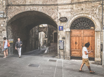 People walking in historic building