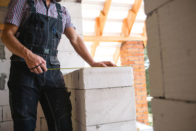 Low section of man standing on steps