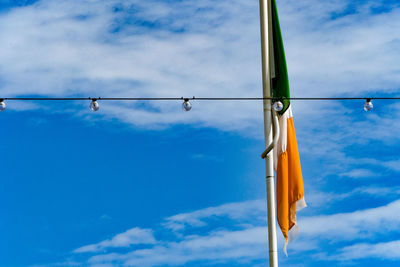 Close-up of indian flag against blue sky