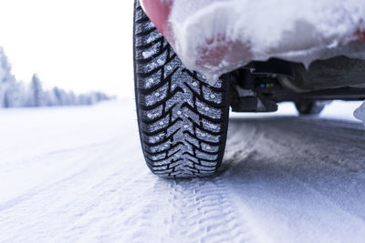 Close-up of snow covered car