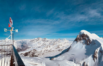 Snowcapped mountains against blue sky