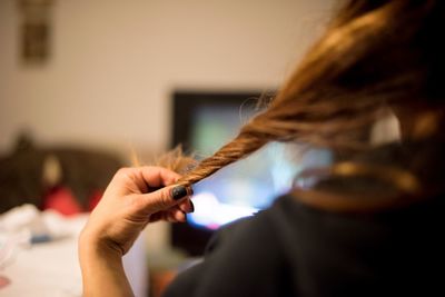 Cropped image of woman holding hair