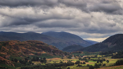 Scenic view of landscape and mountains against sky