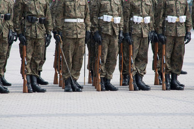 Low section of soldiers standing on floor in parade