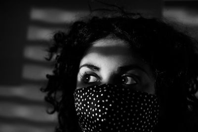 Black and white portrait with mask and fantastic eyes