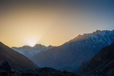 Scenic view of mountains against sky during sunset