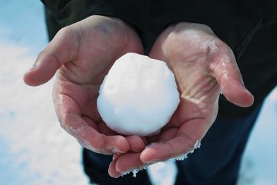 Close-up of hand holding ice cream