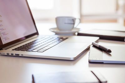 Close-up of laptop on table