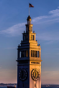 Low angle view of clock tower against sky