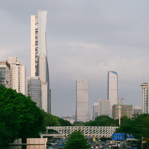 Modern buildings in city against sky