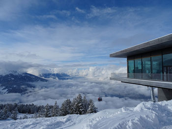 Scenic view of snow covered mountains against sky