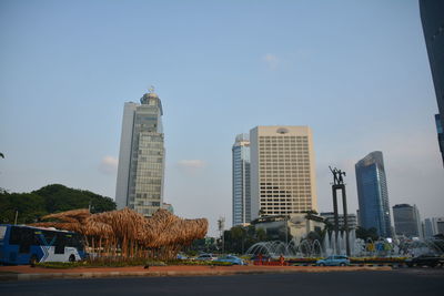 Buildings in city against sky