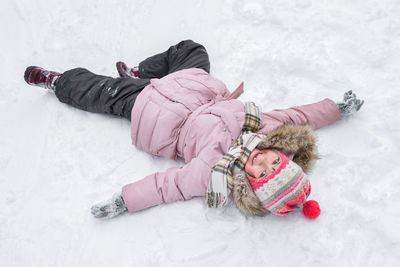 High angle view of woman skiing on snow