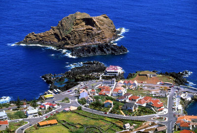 View of built structure by sea