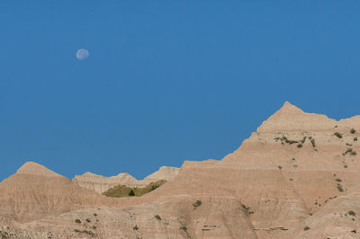 View of desert against blue sky