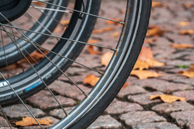 Close-up of bicycle wheels on street